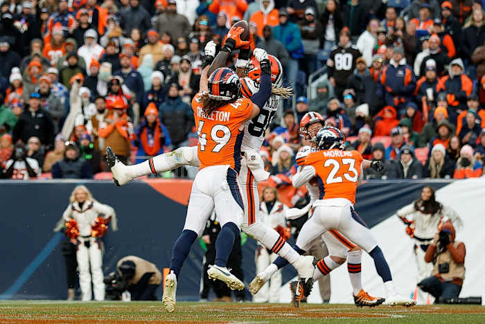 Denver Broncos linebacker Alex Singleton (49) knocks the ball loose from Cleveland Browns tight end David Njoku (85) in the third quarter at Empower Field at Mile High.